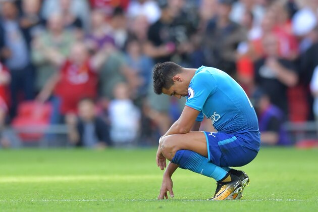 Arsenal's Chilean striker Alexis Sanchez reacts during the English Premier League football match between Liverpool and Arsenal at Anfield in Liverpool, north west England on August 27, 2017. / AFP PHOTO / Anthony Devlin / RESTRICTED TO EDITORIAL USE. No use with unauthorized audio, video, data, fixture lists, club/league logos or 'live' services. Online in-match use limited to 75 images, no video emulation. No use in betting, games or single club/league/player publications.  /         (Photo credit should read ANTHONY DEVLIN/AFP/Getty Images)