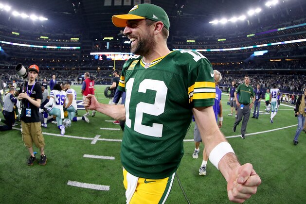 ARLINGTON, TX - JANUARY 15:  Aaron Rodgers #12 of the Green Bay Packers celebrates after Mason Crosby #2 of the Green Bay Packers kicked the game winning field goal against the Dallas Cowboys in the final seconds of a NFC Divisional Playoff game at AT&T Stadium on January 15, 2017 in Arlington, Texas. The Green Bay Packers beat the Dallas Cowboys 34-31  (Photo by Tom Pennington/Getty Images)