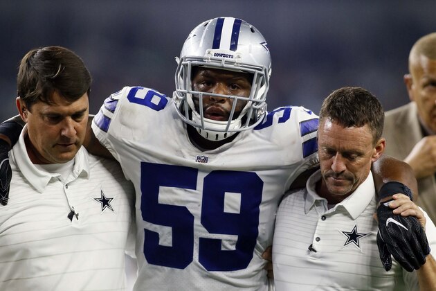 Aug 26, 2017; Arlington, TX, USA; Dallas Cowboys middle linebacker Anthony Hitchens (59) is helped off the field by Dallas Cowboys trainers in the second quarter at AT&T Stadium. Mandatory Credit: Tim Heitman-USA TODAY Sports