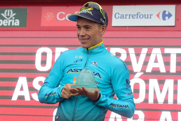 Astana's Colombian Miguel Angel Lopez celebrates on the podium after winning the 11th stage during the 72nd edition of 'La Vuelta' Tour of Spain cycling race, a 187,50 km route between Lorca to Calar Alto on August 30, 2017. / AFP PHOTO / JOSE JORDAN        (Photo credit should read JOSE JORDAN/AFP/Getty Images)