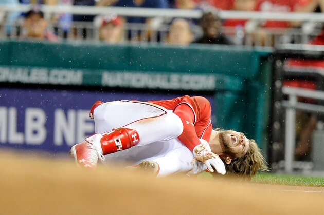 WASHINGTON, DC - AUGUST 12:  Bryce Harper #34 of the Washington Nationals on the ground in pain after injuring his leg in the first inning against the San Francisco Giants at Nationals Park on August 12, 2017 in Washington, DC.  (Photo by G Fiume/Getty Images)