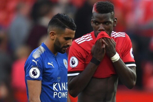 MANCHESTER, ENGLAND - AUGUST 26:  Riyad Mahrez of Leicester City speaks with Paul Pogba of Manchester United following the Premier League match between Manchester United and Leicester City at Old Trafford on August 26, 2017 in Manchester, England.  (Photo by Ross Kinnaird/Getty Images)