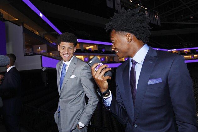 SACRAMENTO, CA - JUNE 24: The Sacramento Kings 2017 Draft Picks De'Aaron Fox and Justin Jackson are tuned to social media at a press event on June 24, 2017 at the Golden 1 Center in Sacramento, California. NOTE TO USER: User expressly acknowledges and agrees that, by downloading and/or using this Photograph, user is consenting to the terms and conditions of the Getty Images License Agreement. Mandatory Copyright Notice: Copyright 2017 NBAE (Photo by Rocky Widner/NBAE via Getty Images)