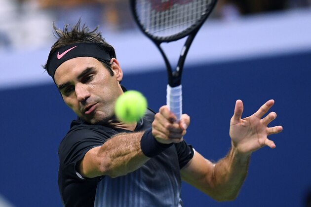 TOPSHOT - Switzerland's Roger Federer returns the ball to Frances Tiafoe of the US during their 2017 US Open Men's Singles match at the USTA Billie Jean King National Tennis Center in New York on August 29, 2017.
/ AFP PHOTO / Jewel SAMAD (Photo credit should read JEWEL SAMAD/AFP/Getty Images) TOPSHOT - Switzerland's Roger Federer returns the ball to Frances Tiafoe of the US during their 2017 US Open Men's Singles match at the USTA Billie Jean King National Tennis Center in New York on August 29, 2017.
/ AFP PHOTO / Jewel SAMAD (Photo credit should read JEWEL SAMAD/AFP/Getty Images)
