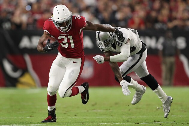 GLENDALE, AZ - AUGUST 12:  Running back David Johnson #31 of the Arizona Cardinals rushes the football past cornerback David Amerson #29 of the Oakland Raiders during the NFL game at the University of Phoenix Stadium on August 12, 2017 in Glendale, Arizona. The Cardinals defeated the Raiders 20-10.  (Photo by Christian Petersen/Getty Images)