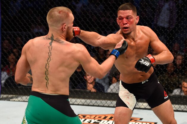 LAS VEGAS, NV - AUGUST 20:   (R-L) Nate Diaz punches Conor McGregor of Ireland in their welterweight bout during the UFC 202 event at T-Mobile Arena on August 20, 2016 in Las Vegas, Nevada. (Photo by Josh Hedges/Zuffa LLC/Zuffa LLC via Getty Images)