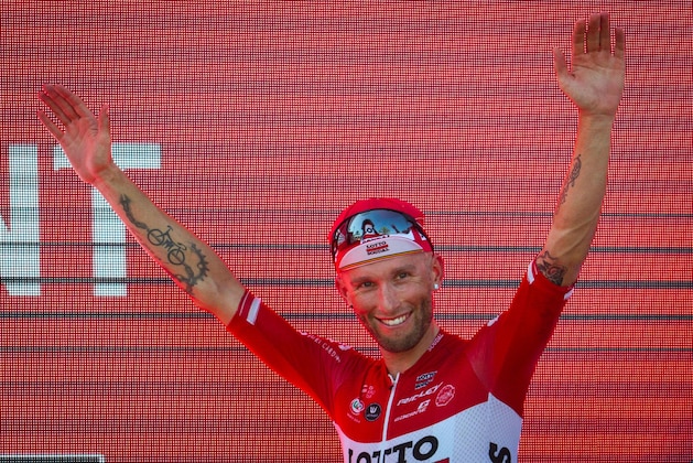 Lotto Soudal's Polish cyclist Tomasz Marczynski celebrates on the podium after winning the 6th stage of the 72nd edition of 'La Vuelta' Tour of Spain cycling race, a 204,4km route between Vila-Real to Sagunto on August 24, 2017. / AFP PHOTO / JAIME REINA        (Photo credit should read JAIME REINA/AFP/Getty Images)