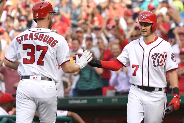WASHINGTON, DC - AUGUST 30:  Stephen Strasburg #37 of the Washington Nationals celebrates hitting a solo home run in the fifth inning with Trea Turner #7 during a baseball game against the Miami Marlins at Nationals Park on August 30, 2017 in Washington,DC.  (Photo by Mitchell Layton/Getty Images)