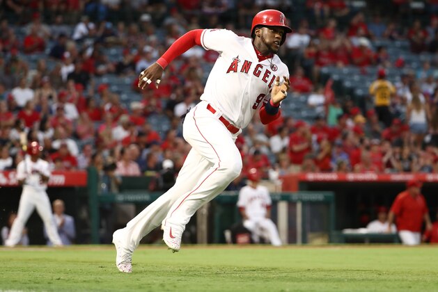 ANAHEIM, CA - AUGUST 28:  Cameron Maybin #9 of the Los Angeles Angels of Anaheim runs to first base on his double to left field during the first inning of the MLB game against the Oakland Athletics at Angel Stadium of Anaheim on August 28, 2017 in Anaheim, California. The Angels defeated the Athletics 3-1.  (Photo by Victor Decolongon/Getty Images)
