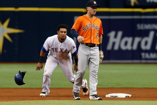 ST. PETERSBURG, FL - AUGUST 31:  Carlos Gomez #14 of the Texas Rangers steals second base ahead of shortstop Alex Bregman #2 of the Houston Astros during the second inning of a game on August 31, 2017 at Tropicana Field in St. Petersburg, Florida. (Photo by Brian Blanco/Getty Images)