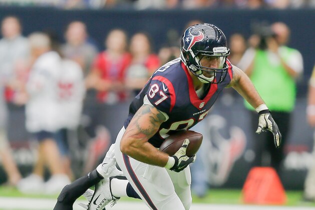 HOUSTON, TX - OCTOBER 30: C.J. Fiedorowicz #87 of the Houston Texans breaks tackle attempt by Tavon Wilson #32 of the Detroit Lions at NRG Stadium on October 30, 2016 in Houston, Texas.  (Photo by Bob Levey/Getty Images)