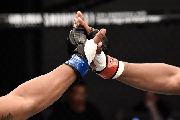 LAS VEGAS, NV - AUGUST 08:   (R-L) Michael Rodriguez touches gloves with Jamelle Jones in their light heavyweight bout during Dana White's Tuesday Night Contender Series at the TUF Gym on August 8, 2017 in Las Vegas, Nevada. (Photo by Brandon Magnus/DWTNCS)
