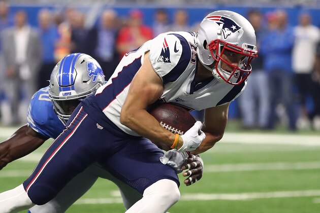DETROIT, MI - AUGUST 25: Chris Hogan #15 of the New England Patriots scores a first quarter touchdown past the tackle of Jarrad Davis #40 of the Detroit Lions during a preseason game at Ford Field on August 25, 2017 in Detroit, Michigan. (Photo by Gregory Shamus/Getty Images)