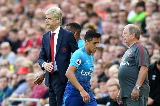 LIVERPOOL, ENGLAND - AUGUST 27:  Alexis Sanchez of Arsenal and Arsene Wenger, Manager of Arsenal embrace after he is subbed during the Premier League match between Liverpool and Arsenal at Anfield on August 27, 2017 in Liverpool, England.  (Photo by Michael Regan/Getty Images)