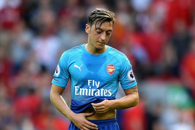 LIVERPOOL, ENGLAND - AUGUST 27:  Mesut Ozil of Arenal is dejected after the Premier League match between Liverpool and Arsenal at Anfield on August 27, 2017 in Liverpool, England.  (Photo by Michael Regan/Getty Images)
