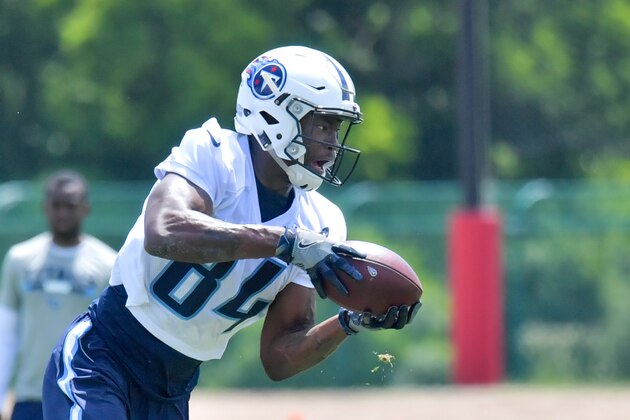Jun 13, 2017; Nashville, TN, USA; Tennessee Titans wide receiver Corey Davis (84) catches a pass during OTA at St Thomas Sports Park  Mandatory Credit: Jim Brown-USA TODAY Sports