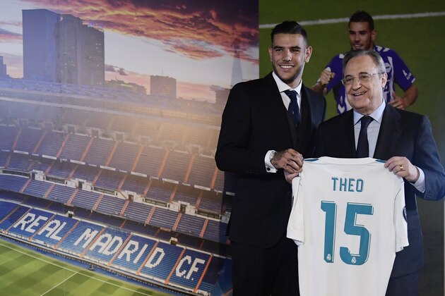 Real Madrid's French new player Theo Hernandez (L) poses with his new shirt next to Real Madrid President Florentino Perez during his presentation at the Santiago Bernabeu stadium in Madrid, on July 10, 2017. / AFP PHOTO / JAVIER SORIANO        (Photo credit should read JAVIER SORIANO/AFP/Getty Images)