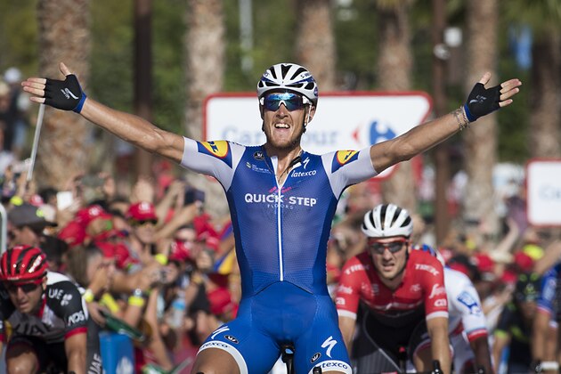 Quick-Step Floors Team's Italian cyclist Matteo Trentin celebrates as he crosses the finish line to win the 4th stage of the 72nd edition of 'La Vuelta' Tour of Spain cycling race, a 198,2km route between Escaldes-Engordany to Tarragona on August 22, 2017. / AFP PHOTO / JAIME REINA        (Photo credit should read JAIME REINA/AFP/Getty Images)