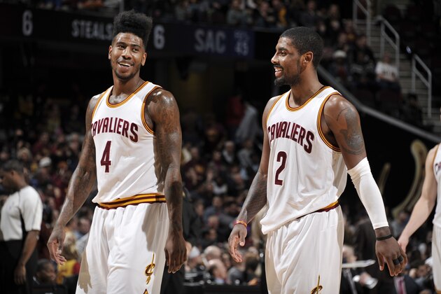 CLEVELAND, OH - FEBRUARY 8:  Iman Shumpert #4 of the Cleveland Cavaliers and Kyrie Irving #2 of the Cleveland Cavaliers during the game against the Sacramento Kings on February 8, 2016 at Quicken Loans Arena in Cleveland, Ohio. NOTE TO USER: User expressly acknowledges and agrees that, by downloading and/or using this Photograph, user is consenting to the terms and conditions of the Getty Images License Agreement. Mandatory Copyright Notice: Copyright 2016 NBAE  (Photo by David Liam Kyle/NBAE via Getty Images)
