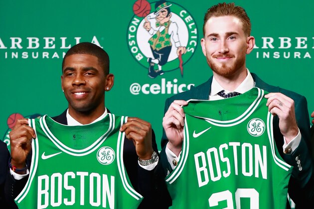 BOSTON, MA - SEPTEMBER 01:  Kyrie Irving #11 and Gordon Hayward #20 hold up their jesrseys as they are introduced as the newest members of the Boston Celtics at TD Gardens on September 1, 2017 in Boston, Massachusetts.  (Photo by Omar Rawlings/Getty Images)