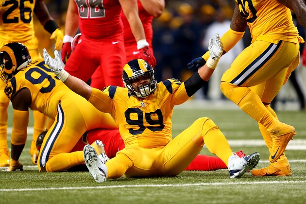 ST. LOUIS, MO - DECEMBER 17: Aaron Donald #99 of the St. Louis Rams celebrates after making a tackle in the second quarter against the Tampa Bay Buccaneers at the Edward Jones Dome on December 17, 2015 in St. Louis, Missouri. (Photo by Dilip Vishwanat/Getty Images)