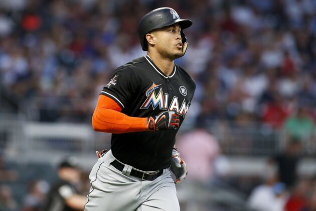 Aug 4, 2017; Atlanta, GA, USA; Miami Marlins right fielder Giancarlo Stanton (27) hits a home run against the Atlanta Braves in the fourth inning at SunTrust Park. Mandatory Credit: Brett Davis-USA TODAY Sports