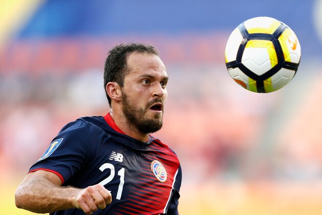 HOUSTON, TX - JULY 11: Marco Urena #21 of Costa Rica brings the ball up the field against Canada at BBVA Compass Stadium on July 11, 2017 in Houston, Texas.  (Photo by Bob Levey/Getty Images)