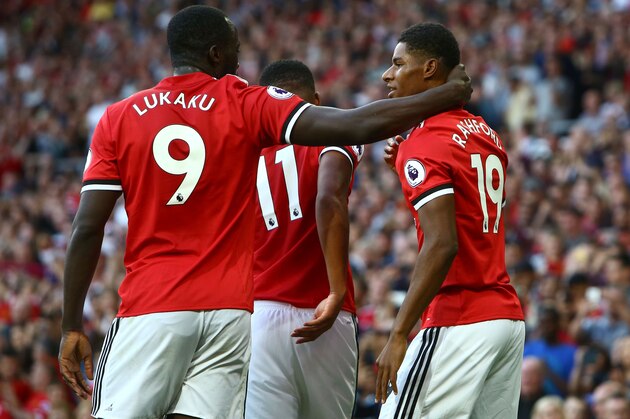 Manchester United's English striker Marcus Rashford (R) celebrates with Manchester United's Belgian striker Romelu Lukaku after scoring the opening goal of the English Premier League football match between Manchester United and Leicester City at Old Trafford in Manchester, north west England, on August 26, 2017. / AFP PHOTO / Geoff CADDICK / RESTRICTED TO EDITORIAL USE. No use with unauthorized audio, video, data, fixture lists, club/league logos or 'live' services. Online in-match use limited to 75 images, no video emulation. No use in betting, games or single club/league/player publications.  /         (Photo credit should read GEOFF CADDICK/AFP/Getty Images)