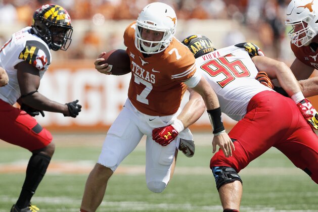 AUSTIN, TX - SEPTEMBER 02:  Shane Buechele #7 of the Texas Longhorns scrambles and is tackled by Brett Kulka #96 of the Maryland Terrapins in the second quarter at Darrell K Royal-Texas Memorial Stadium on September 2, 2017 in Austin, Texas.  (Photo by Tim Warner/Getty Images)