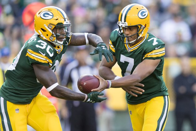 Aug 31, 2017; Green Bay, WI, USA; Green Bay Packers quarterback Brett Hundley (7) hands the football off to running back Jamaal Williams (30) during the first quarter against the Los Angeles Rams at Lambeau Field. Mandatory Credit: Jeff Hanisch-USA TODAY Sports