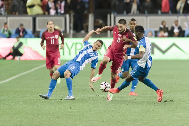 SAN JOSE, CA - MARCH 24:  Clint Dempsey #8 of the United States dribbles the ball between Honduran defenders Oliver Morazon #8 and Maynor Figueroa #3 during the FIFA 2018 World Cup Qualifier match between the United States and Honduras on March 24, 2017 at Avaya Stadium in San Jose, California.  Dempsey scored three goals in the match.   (Photo by David Madison/Getty Images)