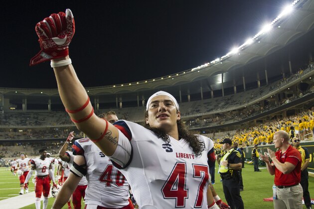 WACO, TX - SEPTEMBER 2:  Remington Green #47 of the Liberty Flames celebrates after defeating the Baylor Bears during the second half at McLane Stadium on September 2, 2017 in Waco, Texas.  (Photo by Cooper Neill/Getty Images)