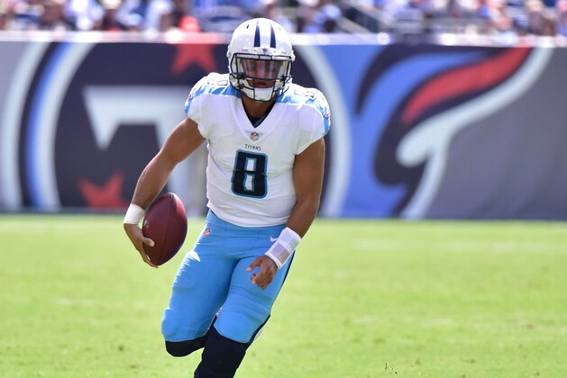 NASHVILLE, TN - AUGUST 27:  Quarterback Marcus Mariota #8 of the Tennessee Titans rolls out of the pocket during the first half of a game against  the Chicago Bears at Nissan Stadium on August 27, 2017 in Nashville, Tennessee.  (Photo by Frederick Breedon/Getty Images)