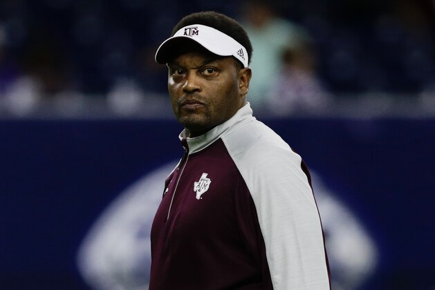 HOUSTON, TX - DECEMBER 28:  head coach Kevin Sumlin of the Texas A&M Aggies  watches over warm ups before playing Kansas State Wildcats in the AdvoCare V100 Texas Bowl on December 28, 2016 in Houston, Texas.  (Photo by Bob Levey/Getty Images)