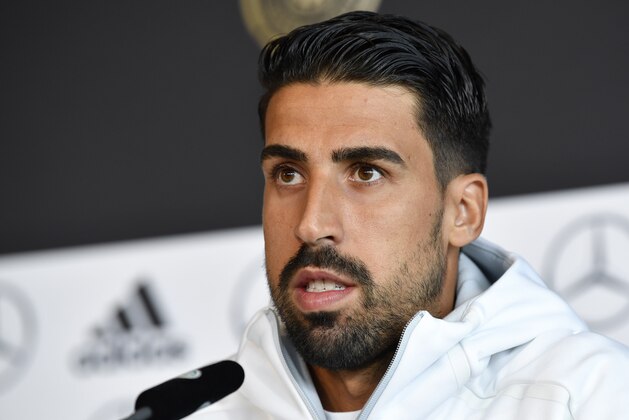 German national football team midfielder Sami Khedira attends a press conference in Stuttgart, southwestern Germany, on September 3, 2017, on the eve of the FIFA World Cup 2018 qualification football match between Germany and Norway. / AFP PHOTO / THOMAS KIENZLE        (Photo credit should read THOMAS KIENZLE/AFP/Getty Images)