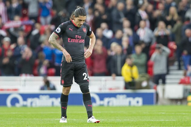 Arsenal's Spanish defender Hector Bellerin reacts to their defeat on the pitch after the English Premier League football match between Stoke City and Arsenal at the Bet365 Stadium in Stoke-on-Trent, central England on August 19, 2017.
Stoke won the game 1-0. / AFP PHOTO / Roland Harrison / RESTRICTED TO EDITORIAL USE. No use with unauthorized audio, video, data, fixture lists, club/league logos or 'live' services. Online in-match use limited to 75 images, no video emulation. No use in betting, games or single club/league/player publications.  /         (Photo credit should read ROLAND HARRISON/AFP/Getty Images)