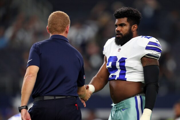 ARLINGTON, TX - AUGUST 26: Head coach Jason Garrett of the Dallas Cowboys shakes hands with Ezekiel Elliott #21 of the Dallas Cowboys during warmups before a preseason game against the Oakland Raiders at AT&T Stadium on August 26, 2017 in Arlington, Texas. (Photo by Tom Pennington/Getty Images)