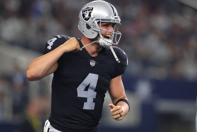 ARLINGTON, TX - AUGUST 26: Derek Carr #4 of the Oakland Raiders celebrates a second quarter touchdown against the Dallas Cowboys in a preseason game at AT&T Stadium on August 26, 2017 in Arlington, Texas. (Photo by Tom Pennington/Getty Images)