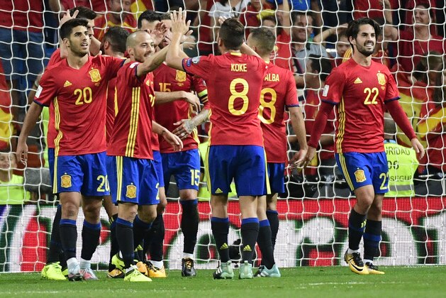 Spain's players celebrate their third goal during the World Cup 2018 qualifier football match between Spain and Italy at the Santiago Bernabeu stadium in Madrid on September 2, 2017. / AFP PHOTO / PIERRE-PHILIPPE MARCOU        (Photo credit should read PIERRE-PHILIPPE MARCOU/AFP/Getty Images)