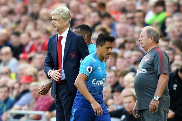 LIVERPOOL, ENGLAND - AUGUST 27:  Alexis Sanchez of Arsenal and Arsene Wenger, Manager of Arsenal embrace after he is subbed during the Premier League match between Liverpool and Arsenal at Anfield on August 27, 2017 in Liverpool, England.  (Photo by Michael Regan/Getty Images)