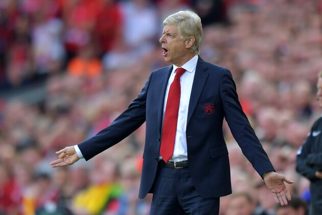 Arsenal's French manager Arsene Wenger gestures on the touchline during the English Premier League football match between Liverpool and Arsenal at Anfield in Liverpool, north west England on August 27, 2017. / AFP PHOTO / Anthony Devlin / RESTRICTED TO EDITORIAL USE. No use with unauthorized audio, video, data, fixture lists, club/league logos or 'live' services. Online in-match use limited to 75 images, no video emulation. No use in betting, games or single club/league/player publications.  /         (Photo credit should read ANTHONY DEVLIN/AFP/Getty Images)