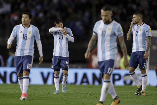 Argentinean players leave the field at the half time during a 2018 World Cup qualifying soccer match against Venezuela in Buenos Aires, Argentina, Tuesday, Sept. 5, 2017. (AP Photo/Victor R. Caivano)