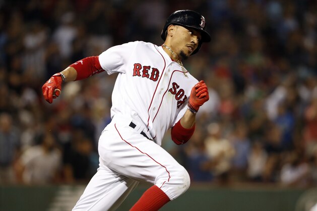 Boston Red Sox's Mookie Betts runs out a double against the Toronto Blue Jays during the ninth inning of a baseball game at Fenway Park in Boston Tuesday, Sept. 5, 2017. (AP Photo/Winslow Townson)
