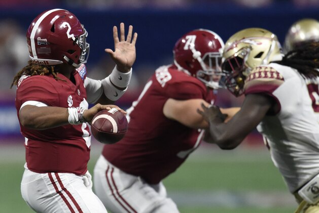 Alabama quarterback Jalen Hurts (2) works against Florida State during the second half of an NCAA football game, Saturday, Sept. 2, 2017, in Atlanta. (AP Photo/Mike Stewart)