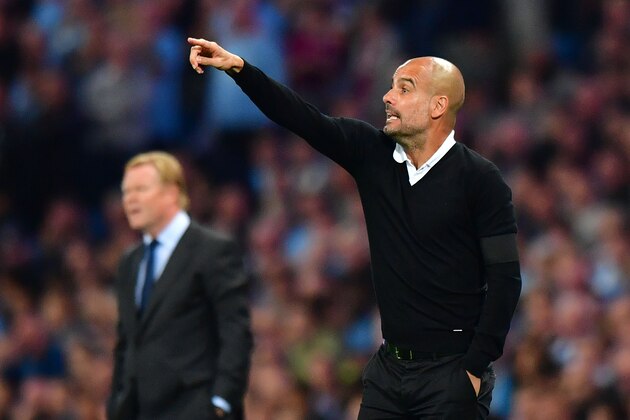Manchester City's Spanish manager Pep Guardiola (R) and Everton's Dutch manager Ronald Koeman gesture during the English Premier League football match between Manchester City and Everton at the Etihad Stadium in Manchester, north west England, on August 21, 2017. / AFP PHOTO / Anthony DEVLIN / RESTRICTED TO EDITORIAL USE. No use with unauthorized audio, video, data, fixture lists, club/league logos or 'live' services. Online in-match use limited to 75 images, no video emulation. No use in betting, games or single club/league/player publications.  /         (Photo credit should read ANTHONY DEVLIN/AFP/Getty Images)