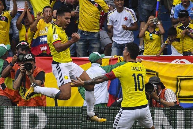 Colombia's Radamel Falcao (L) celebrates with teammate James Rodriguez after scoring against Brazil during their 2018 World Cup football qualifier match, in Barranquilla, Colombia, on September 5, 2017. / AFP PHOTO / Luis ACOSTA        (Photo credit should read LUIS ACOSTA/AFP/Getty Images)
