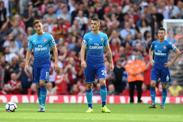 LIVERPOOL, ENGLAND - AUGUST 27:  Mesut Ozil of Arsenal are Granit Xhaka of Arsenal are dejected after Liverpool's fourth goal during the Premier League match between Liverpool and Arsenal at Anfield on August 27, 2017 in Liverpool, England.  (Photo by Michael Regan/Getty Images)
