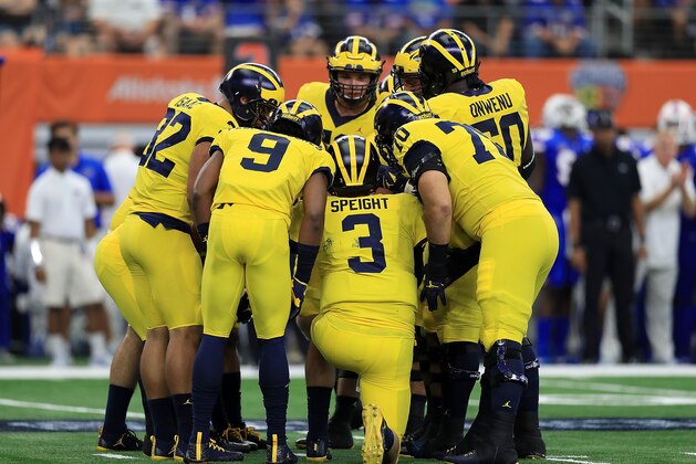 ARLINGTON, TX - SEPTEMBER 02:  Wilton Speight #3 of the Michigan Wolverines huddles with his teammates in the game against the Florida Gators at AT&T Stadium on September 2, 2017 in Arlington, Texas.  (Photo by Ronald Martinez/Getty Images)