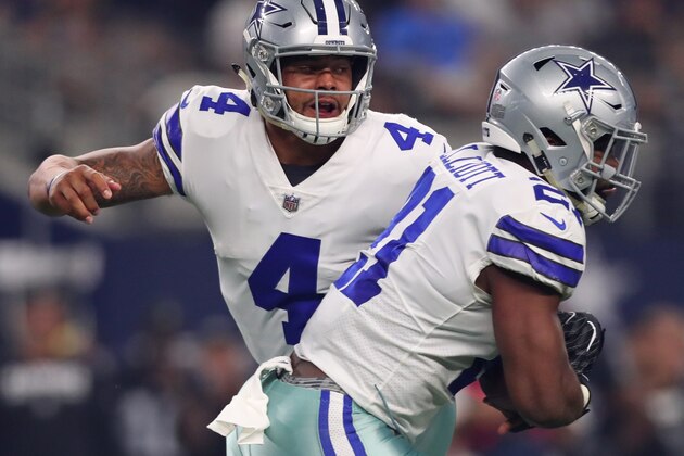 ARLINGTON, TX - AUGUST 26: Dak Prescott #4 of the Dallas Cowboys hands the ball off to Ezekiel Elliott #21 of the Dallas Cowboys in a preseason game at AT&T Stadium on August 26, 2017 in Arlington, Texas. (Photo by Tom Pennington/Getty Images)
