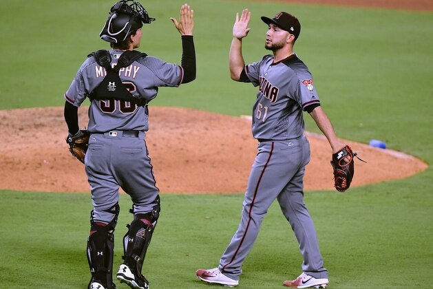 LOS ANGELES, CA - SEPTEMBER 04:  Silvino Bracho #61 of the Arizona Diamondbacks celebrates a 13-0 win, with John Ryan Murphy #36, over the Los Angeles Dodgers at Dodger Stadium on September 4, 2017 in Los Angeles, California.  (Photo by Harry How/Getty Images)